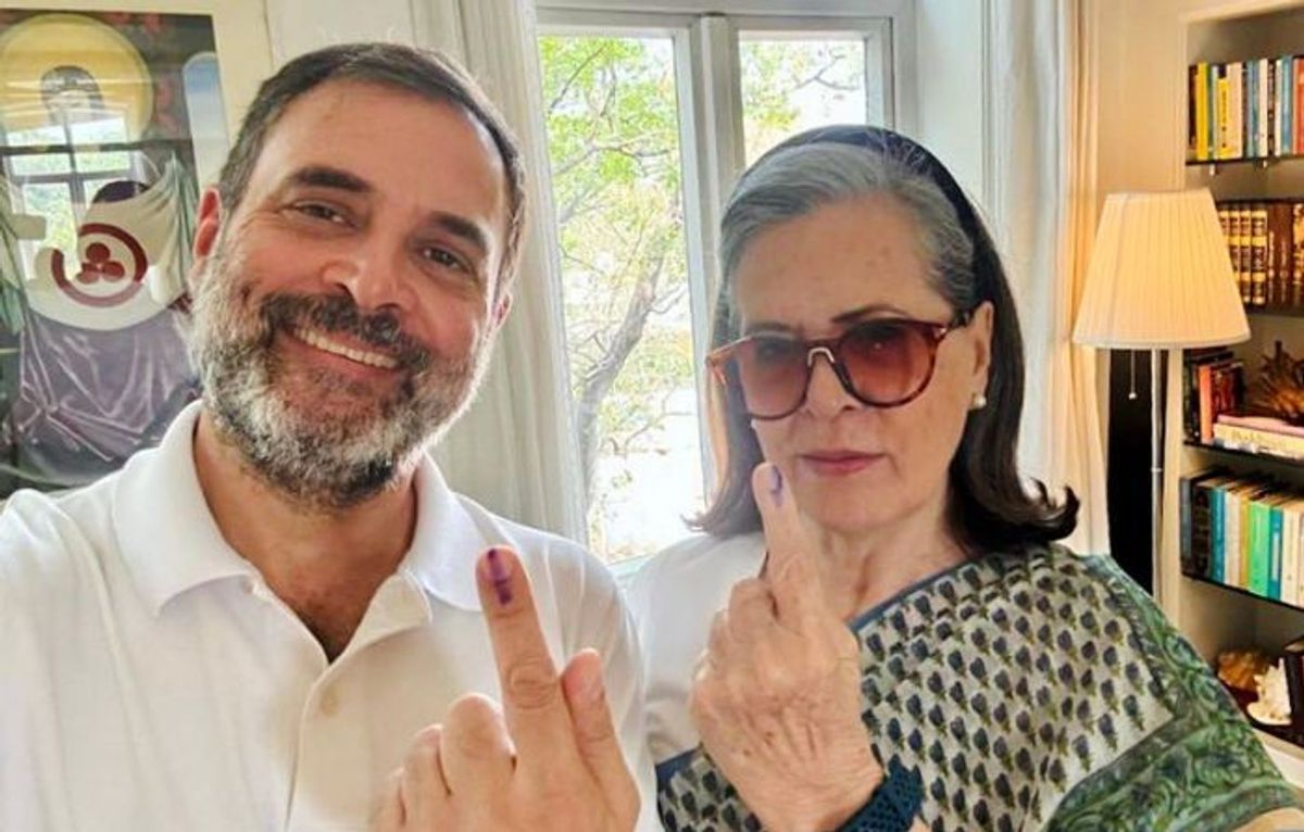Leaders of India's opposition Indian National Congress Rahul Gandhi and Sonia Gandhi take a selfie showing their ink-marked fingers after casting their vote for the sixth phase of the general elections in New Delhi