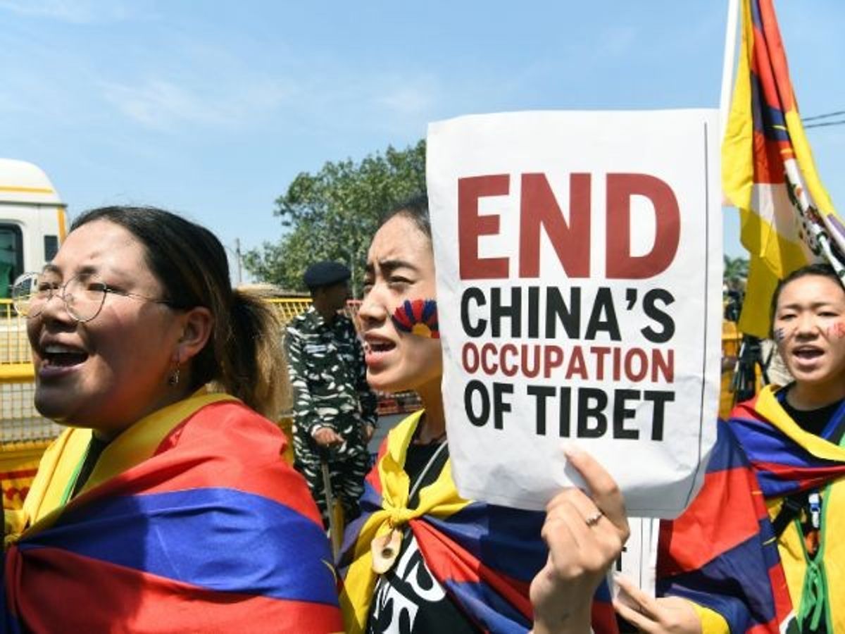 Members of Tibetan community stage a protest against the Chinese government on the eve of G20 Summit, near Majnu ka Tilla, in New Delhi