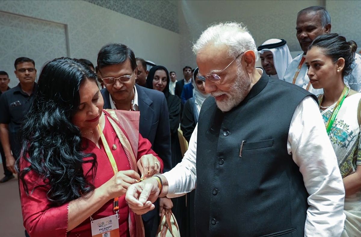 Mexican Senate president Ana Lilia Rivera ties a 'rakhi' on Indian prime minister Narendra Modi's wrist
