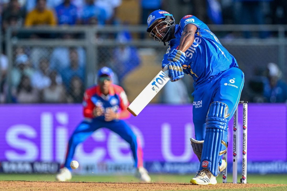 Mumbai Indians' Romario Shepherd hits against Delhi Capitals in IPL 2024