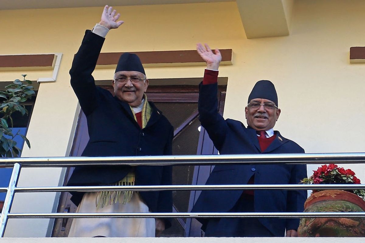 Nepal prime minister Pushpa Kamal Dahal (R) and his predecessor KP Sharma Oli