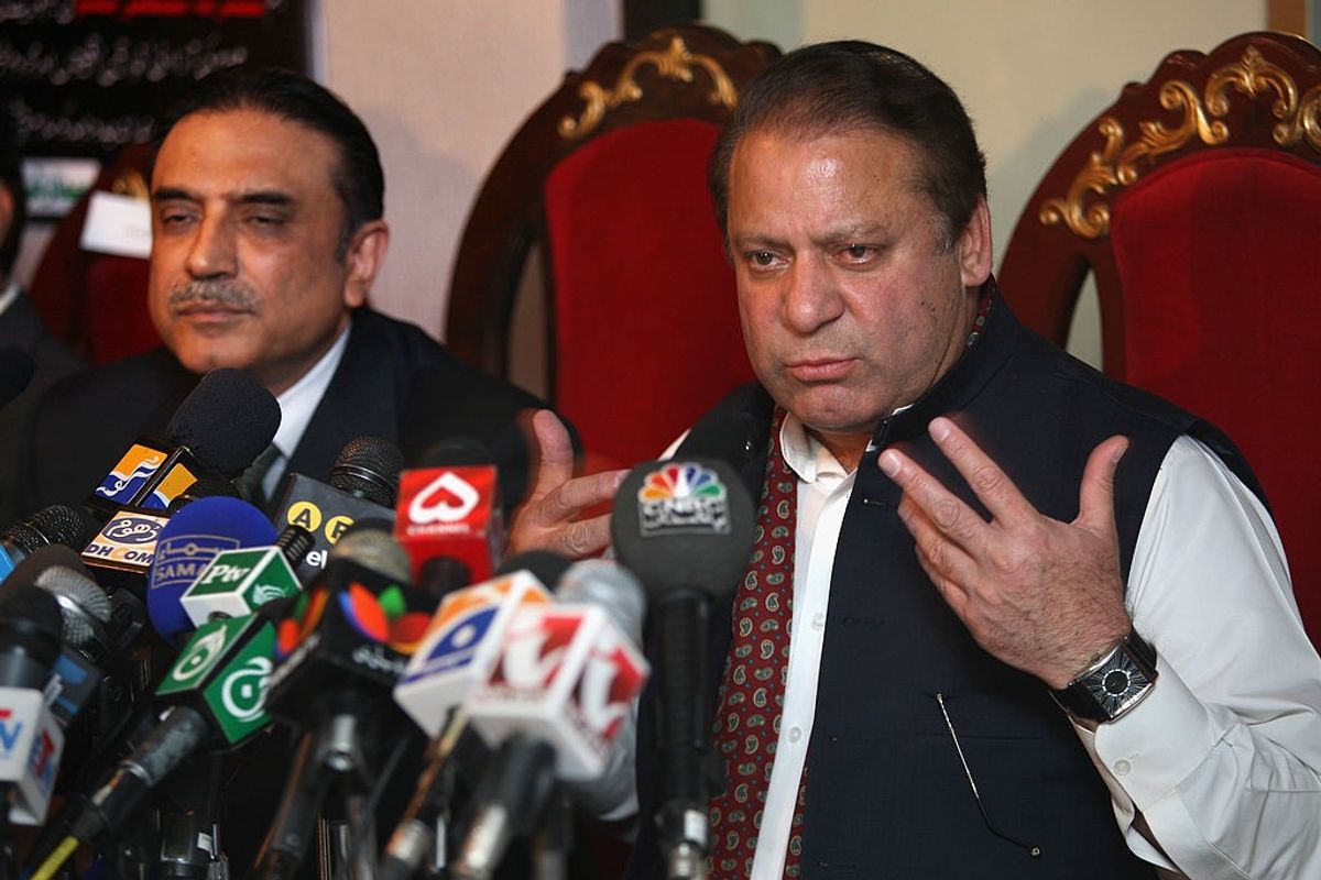 Pakistan's former prime minister Nawaz Sharif (R) former president Asif Ali Zardari