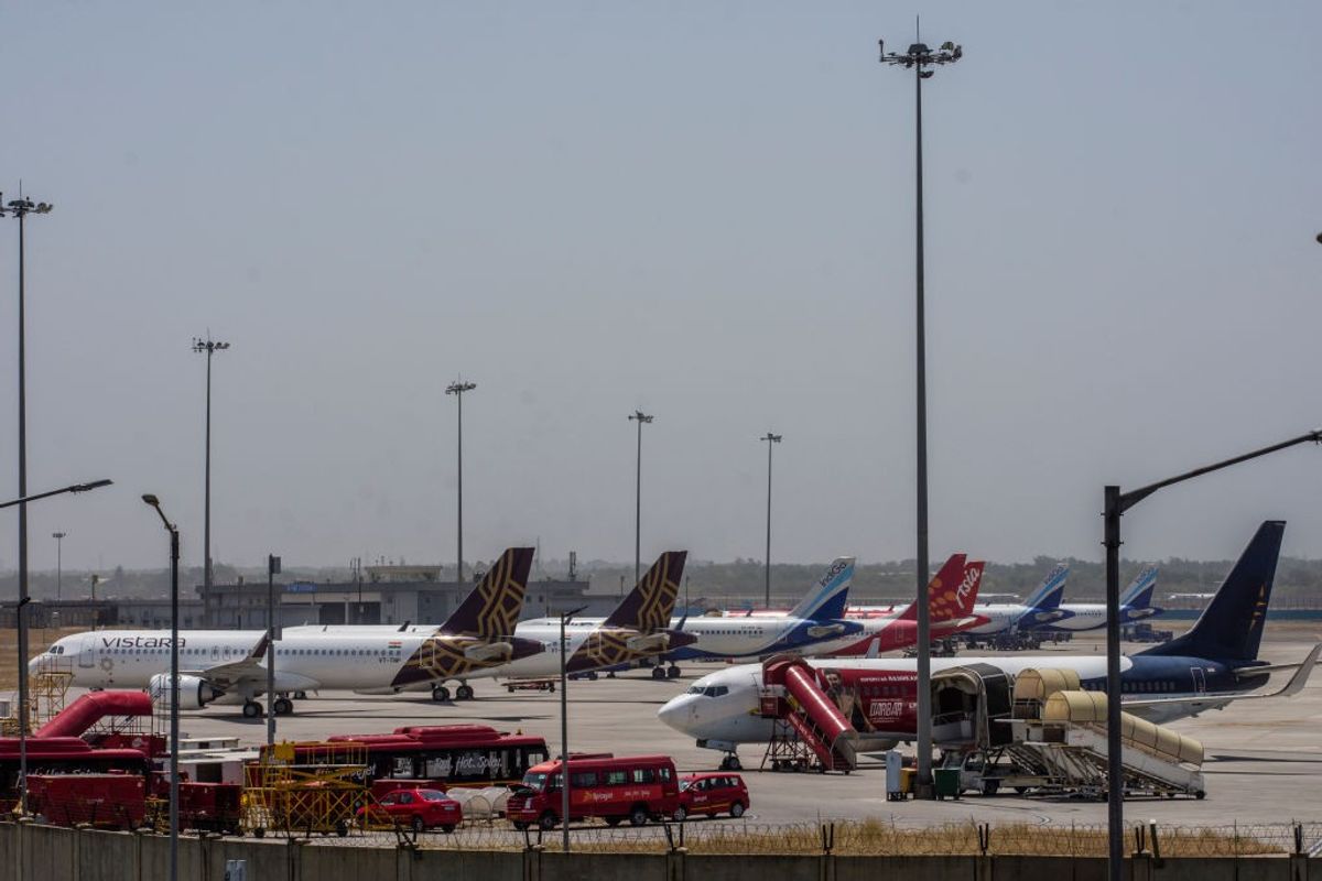 Parked aircraft stand at the Indira Gandhi International Airport in Delhi, India