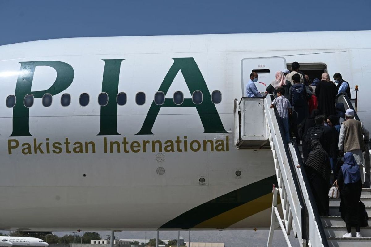 Passengers board a Pakistan International Airlines flight.