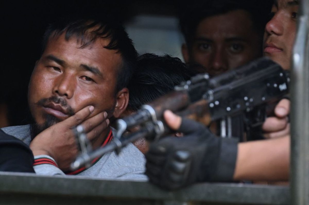 People being evacuated by Indian army personnel to a temporary shelter as they flee ethnic violence that has hit the northeastern state of Manipur, near Imphal, the state capital.