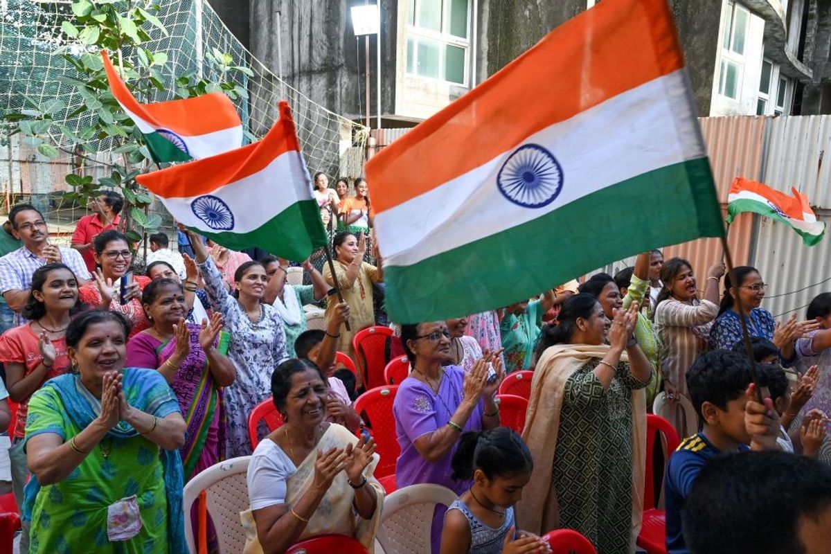 People in India celebrate the successful landing of Chandrayaan-3