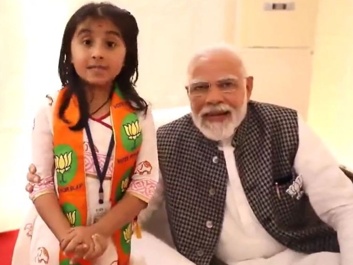 PM Narendra Modi with a girl praising his BJP