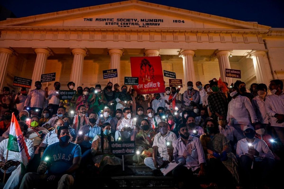 Police ban mass gatherings in Indian village after clashes erupted following the cremation of gang-rape victim
