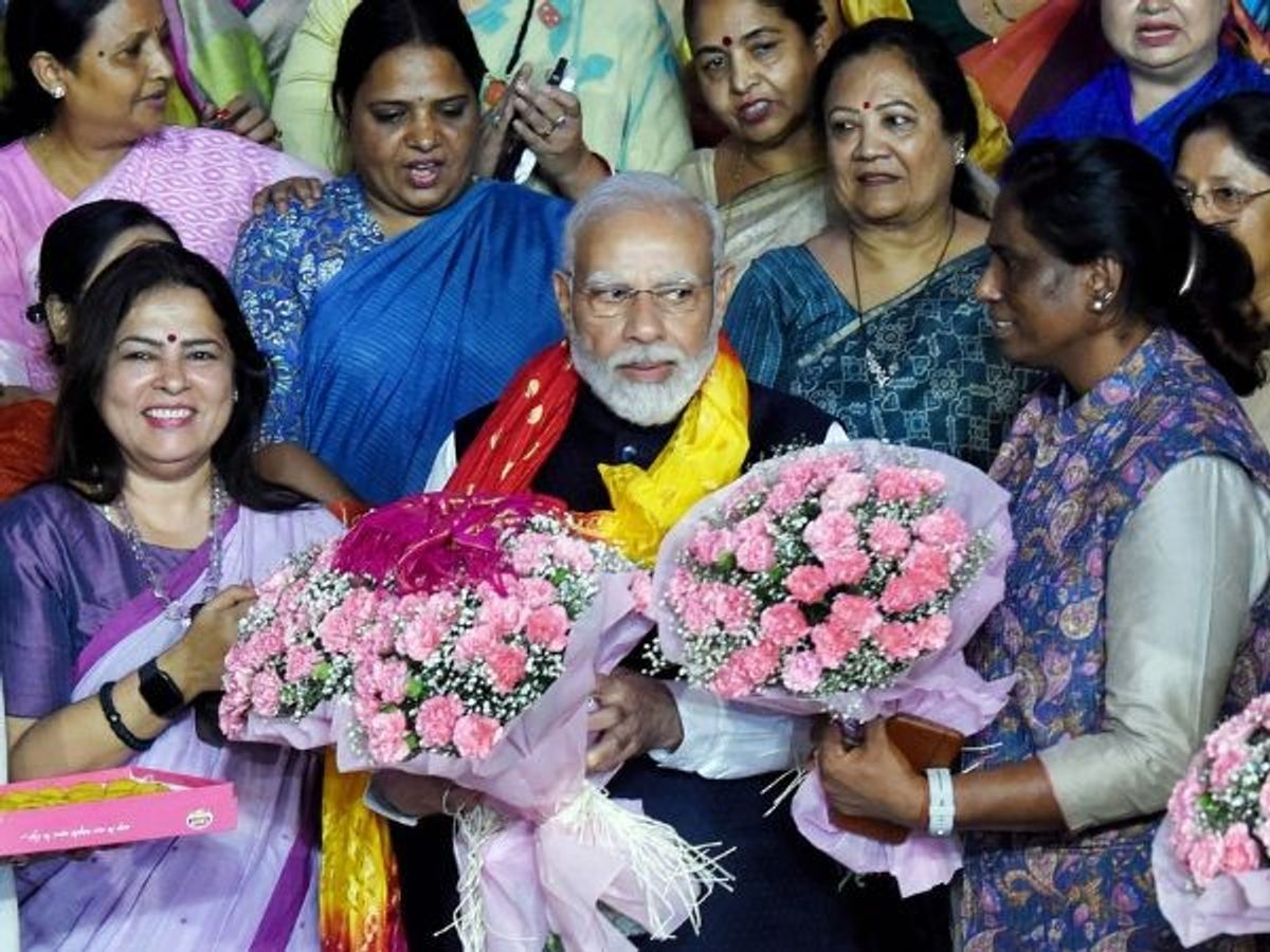 Prime minister Narendra Modi being felicitated by women parliamentarians on the passing of the Women's Reservation Bill in both houses of Parliament, in New Delhi