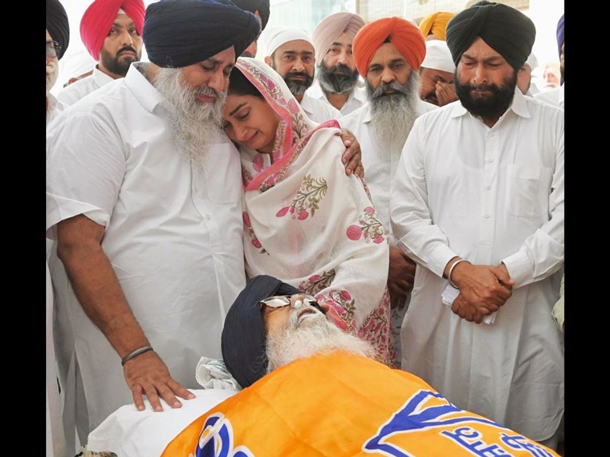 Punjab's former chief minister Parkash Sngh Badal's son and daughter in law weep in front of his mortal remains