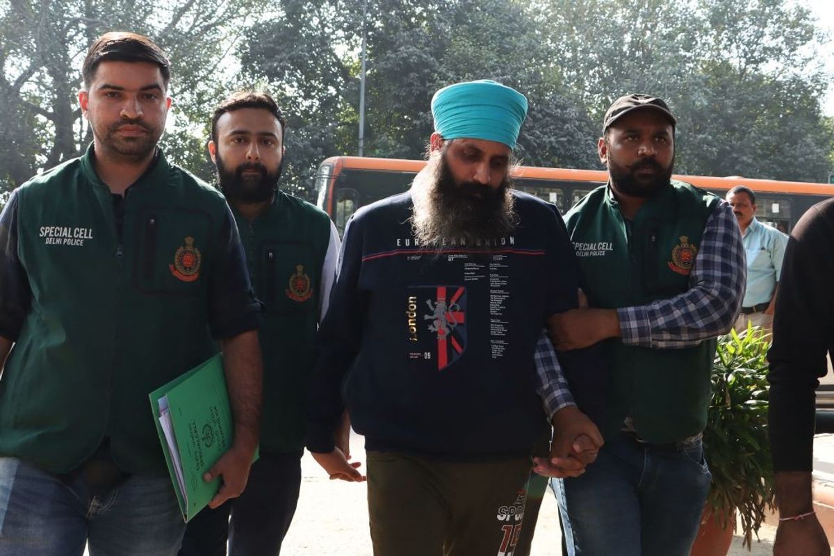 Rajwinder Singh being produced at a court in Delhi