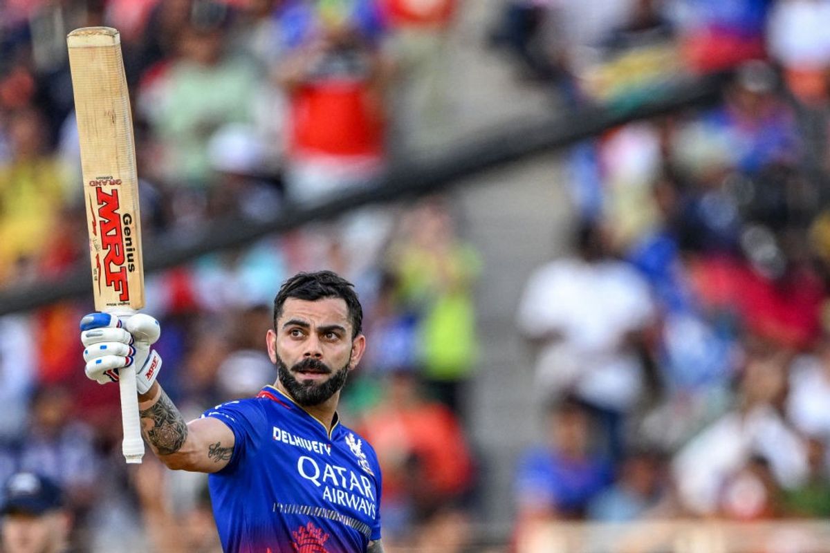 RCB batter Virat Kohli raises his bat after scoring a fifty against Gujarat Titans in IPL 2024
