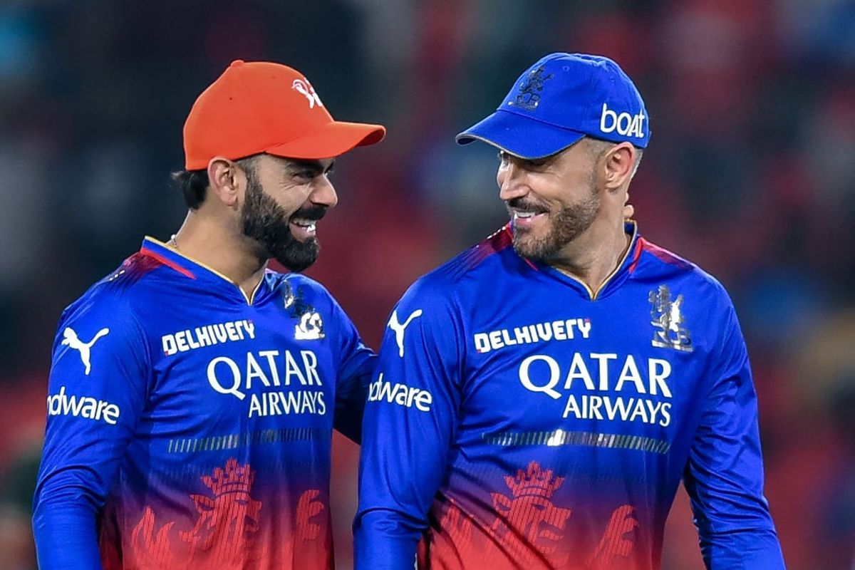 RCB captain Faf du Plessis (R) and Virat Kohli smile after their team beat Sunrisers Hyderabad in IPL 2024