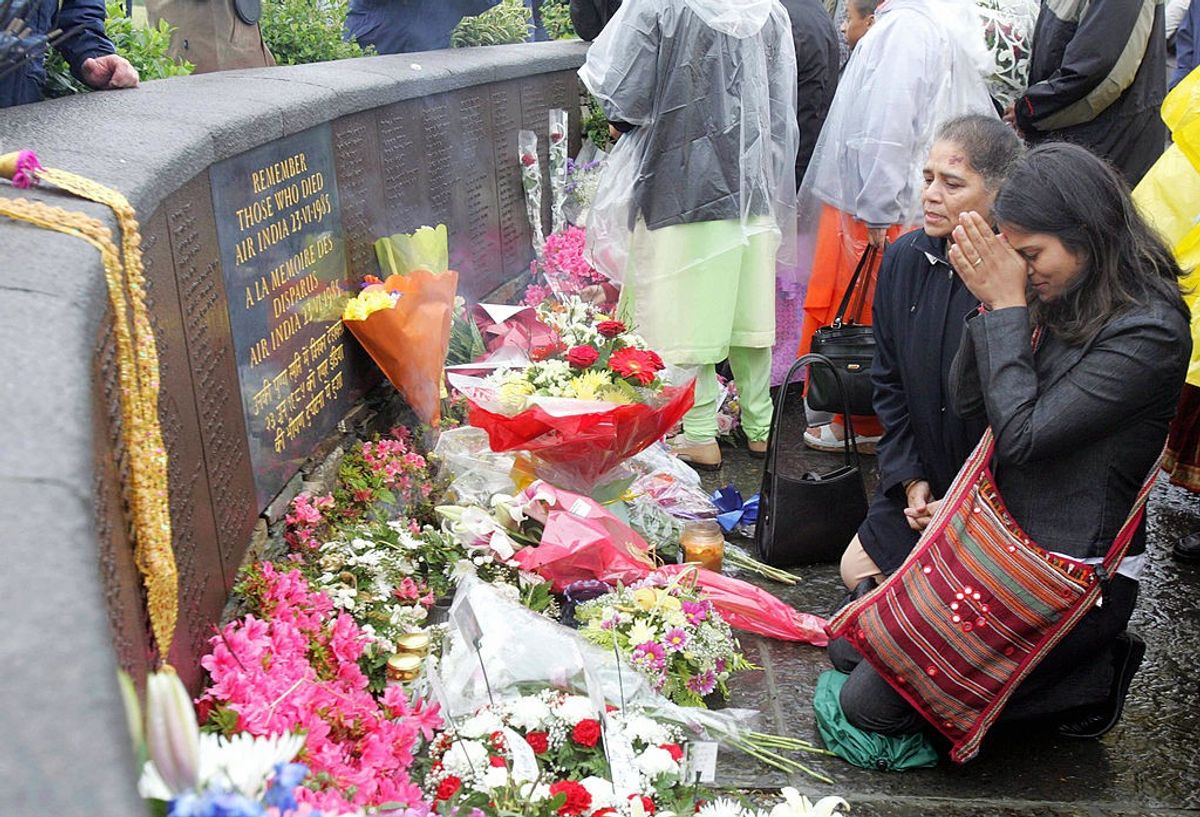 Relatives pray at the memorial commemorating the 20th anniversary of the Air India disaster on June 23, 2005.