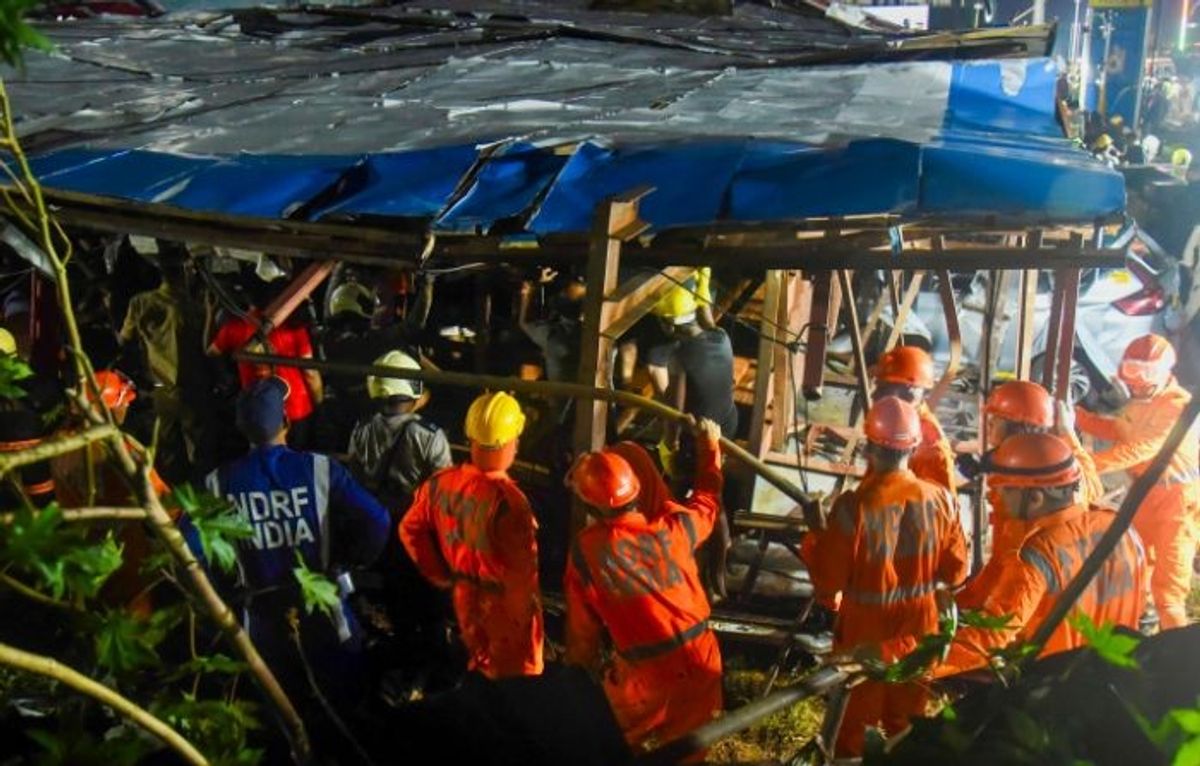 Rescue work underway after a huge billboard collapsed on a fuel station due to strong winds and rain, at Ghatkopar area of the western Indian city of Mumbai, on Monday, May 13, 2024. At least eight people were killed while dozens were injured
