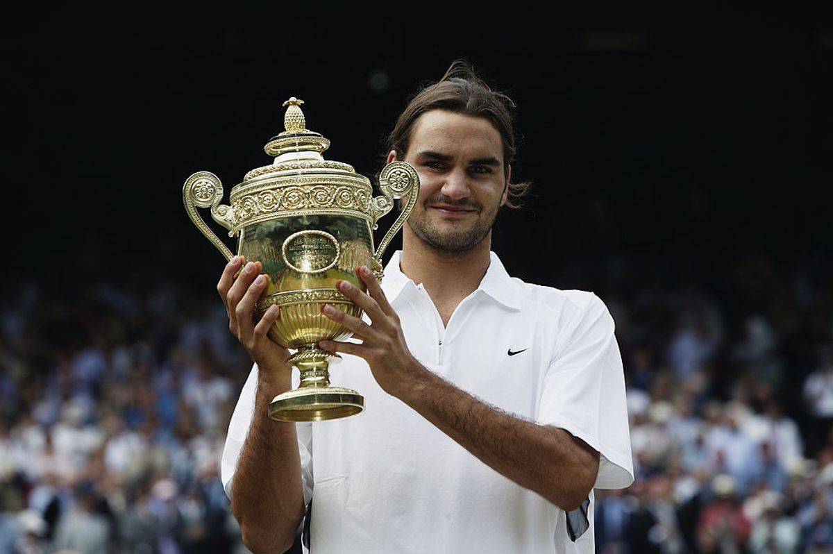 Roger Federer with 2003 Wimbledon trophy
