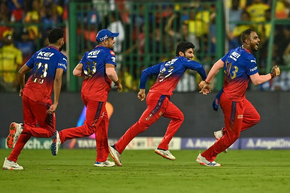 Royal Challengers Bengaluru players celebrate after defeating Chennai Super Kings to reach the playoffs of IPL 2024
