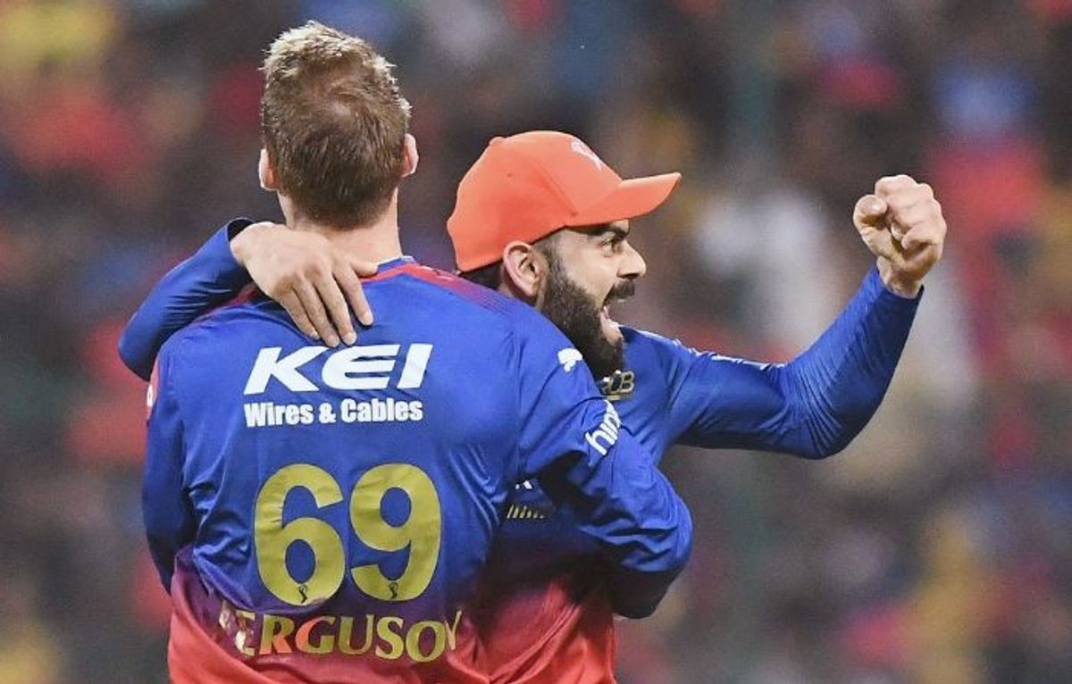 Royal Challengers Bengaluru's Virat Kohli celebrates with a teammate during an Indian Premier League match in the Indian Premier League 2024