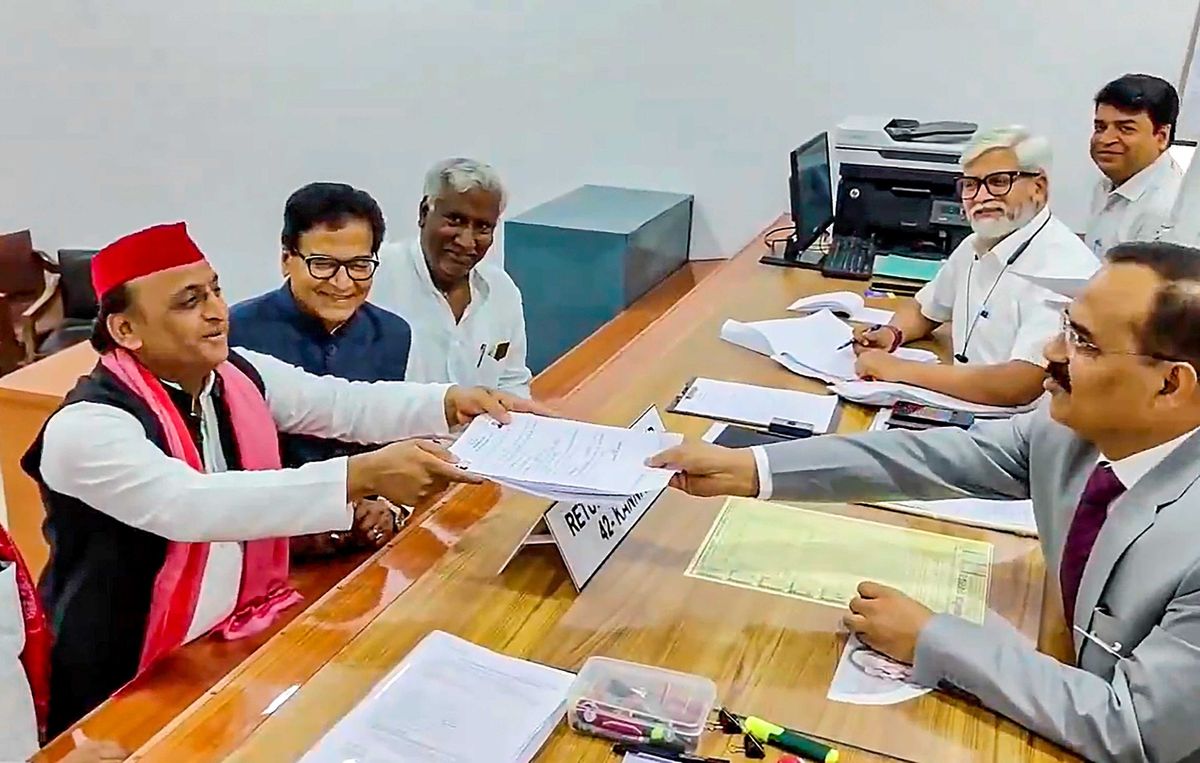 Samajwadi Party chief and former Uttar Pradesh chief minister Akhilesh Yadav (L) files nomination from Kannauj constituency
