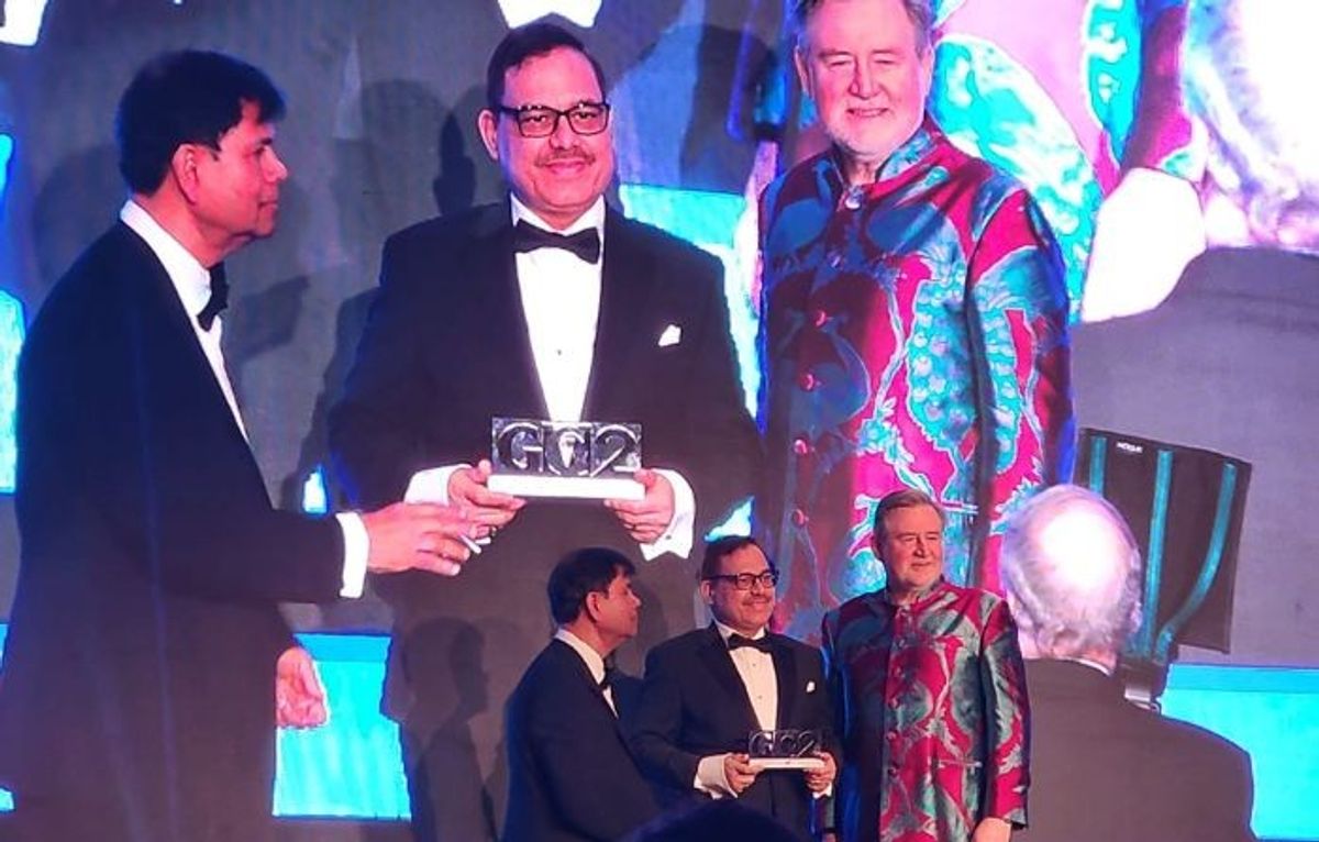 SBI UK regional head (UK Ops) Sudhir Sharma (c) receives the 'Bank of the Year' award at GG2 Leadership and Diversity Awards 2024 in London
