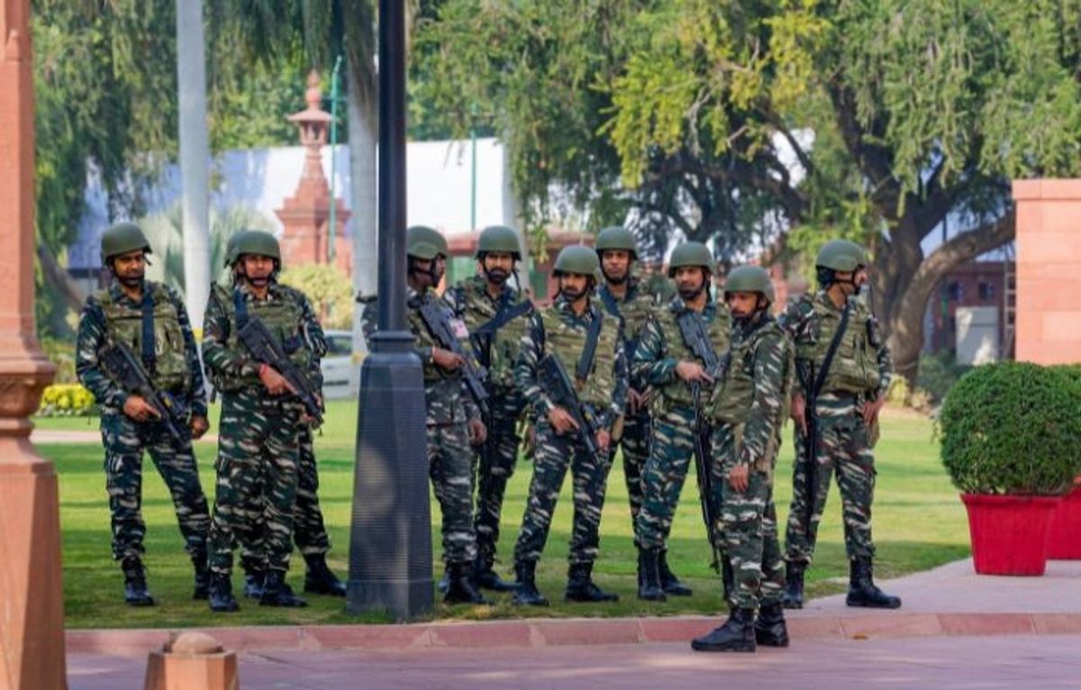 Security personnel outside the Indian parliament House following an intrusion by two persons, in New Delhi,