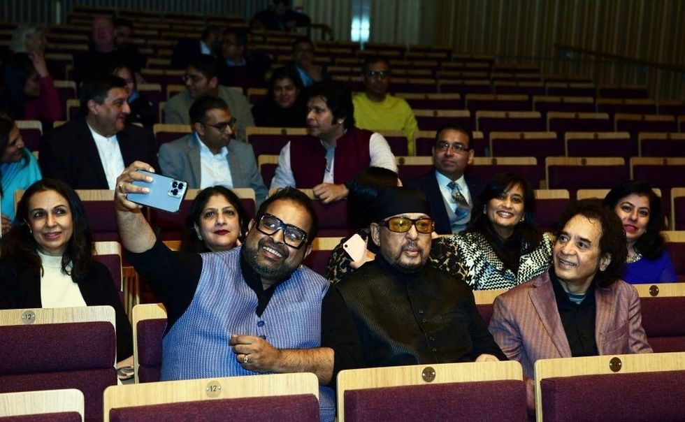 Shankar Mahadevan takes a selfie with Louiz Banks and Zakir Hussain at Birmingham City University February 2022
