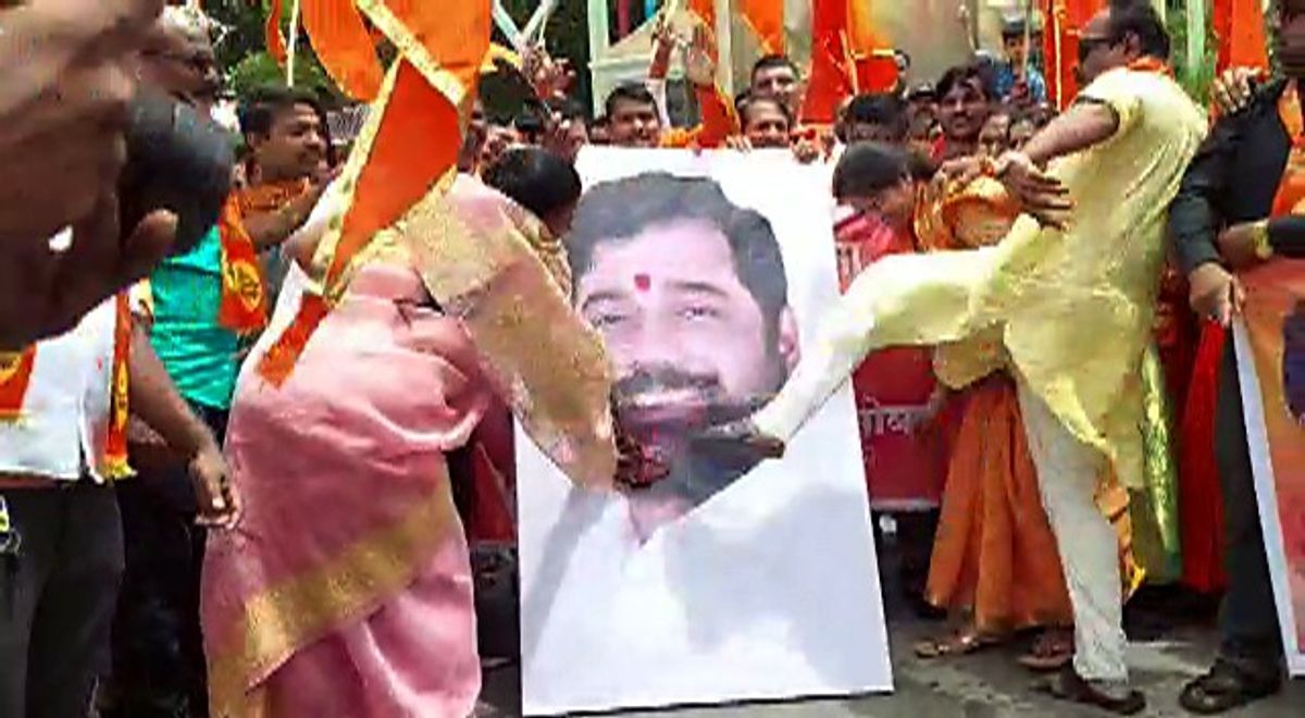 Shiv Sena supporters stage a protest against rebel Shiv Sena leader Eknath Shinde and party MLAs, in Pune on Sunday.