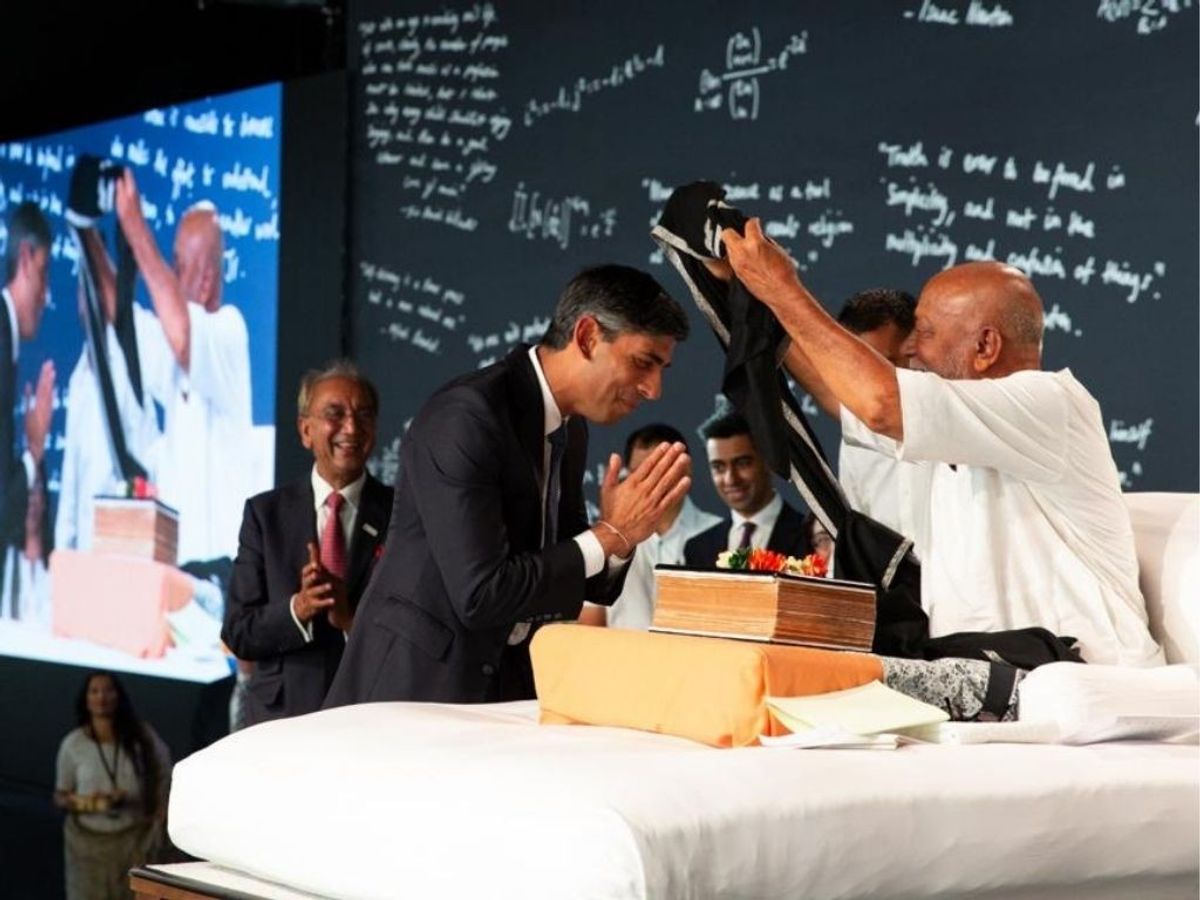 Spiritual leader Morari Bapu blesses British prime minister Rishi Sunak at a Ram Katha event