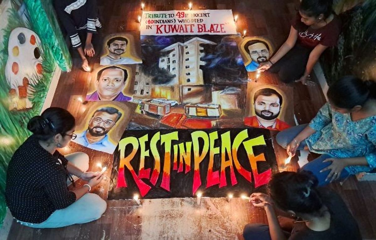 Students of an art college pay tributes to Indians who were killed in a fire in Kuwait on June 12.