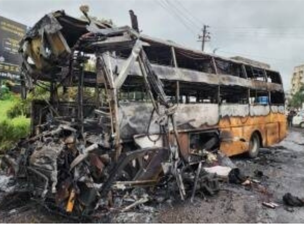 The charred remains of the bus that hit a lorry in Nashik, Maharashtra