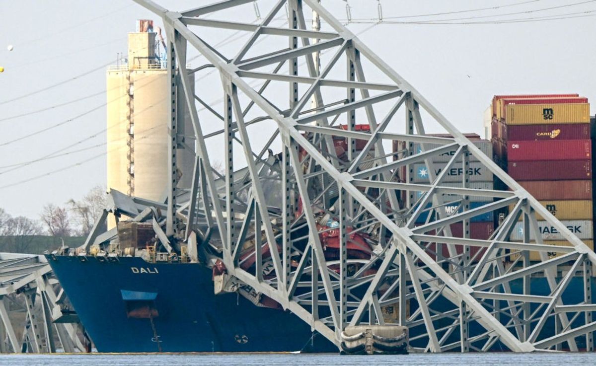 The collapsed Francis Scott Key Bridge lies on top of the container ship Dali in Baltimore, Maryland, US