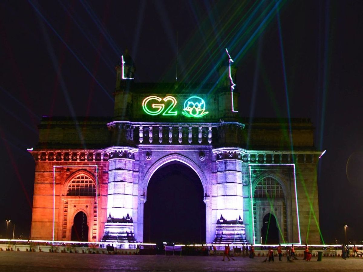 The Gateway of India in Mumbai, India, illuminated with the G20 logo