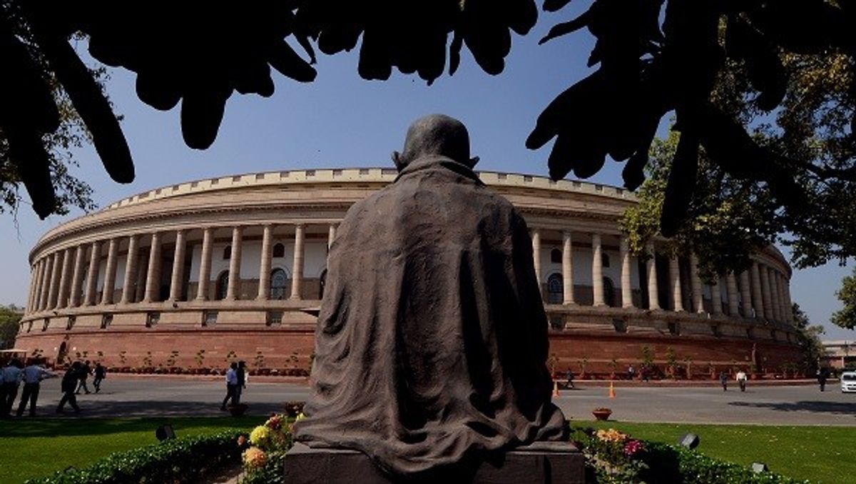 The old Indian parliament and the statue of Mahatma Gandhi
