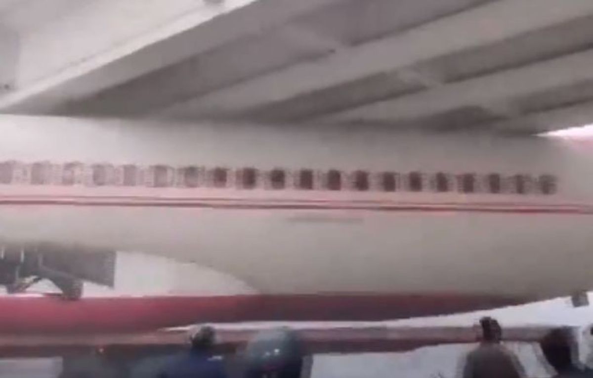 The part of a scrapped aircraft that got stuck under a bridge in Motihari in the northern Indian state of Bihar