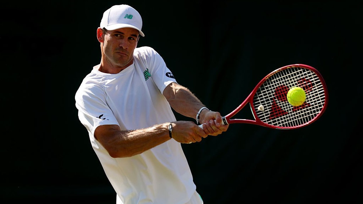 Tommy Paul of United States plays a backhand against Hubert Hurkacz of Poland