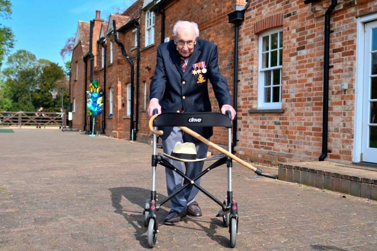 WW-II veteran tops UK music chart as his charity walk breaks world record