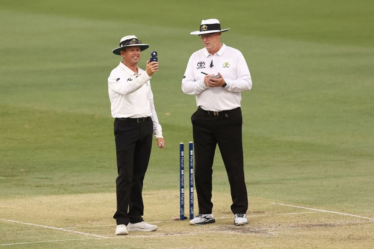 Two umpires officiating a cricket match