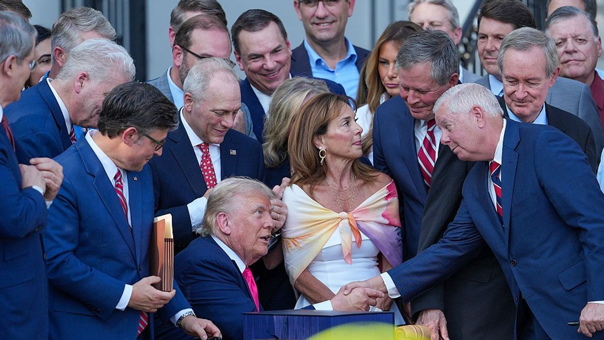 Trump signs sweeping tax and spending bill into law, sparking praise and backlash