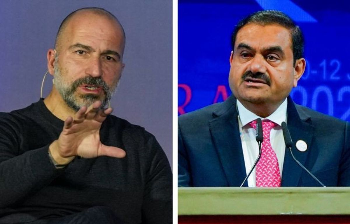 Uber CEO Dara Khosrowshahi (L) and Indian business magnate Gautam Adani