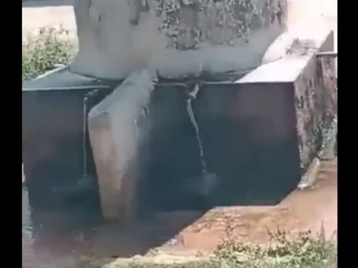 Upper-caste people clean tank in India after a Dalit woman drinks from it