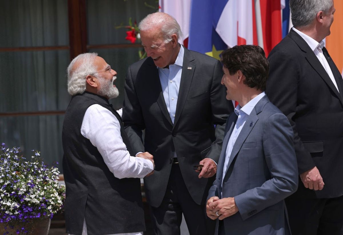US president Joe Biden greets Indian prime minister Narendra Modi as Canadian prime minister Justin Trudeau looks on prior to a group photo of the Outreach working session on the second day of the G7 summit at Schloss Elmau on June 27, 2022 near Garmisch-Partenkirchen, Germany