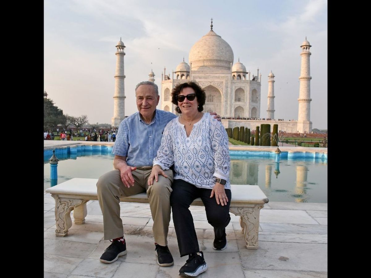 US Senate majority leader Chuck Schumer poses for a photo with his wife at the Taj Mahal, in Agra, India,