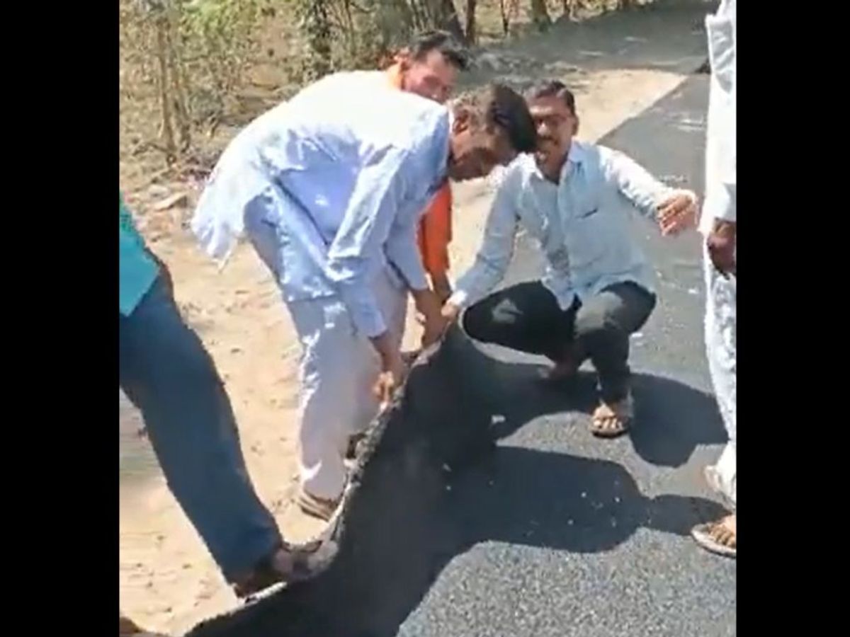 Villagers 'lift' a newly laid road in Jalna district of the western Indian state of Maharashtra
