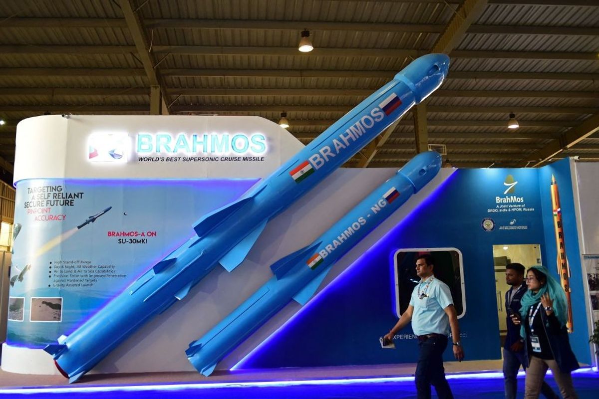 Visitors walk past a model of Indias Brahmos supersonic cruise missile displayed at the Defence Expo 2022 in Gandhinagar in the western Indian state of Gujarat