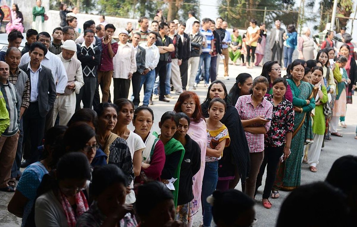 Voters queue for casting ballots during a general election