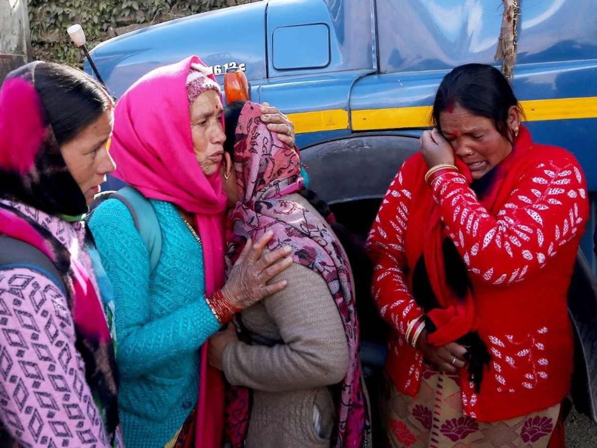 Women break down prior to leaving their home that have been marked unsafe by the district administration and vacate the areas affected by the Joshimath land subsidence in the northern Indian state of Uttarakhand
