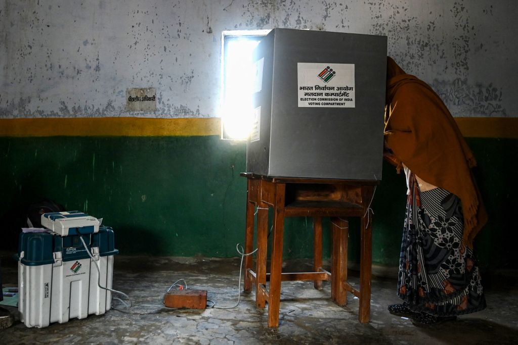 A voter casts ballot in Uttar Pradesh elections
