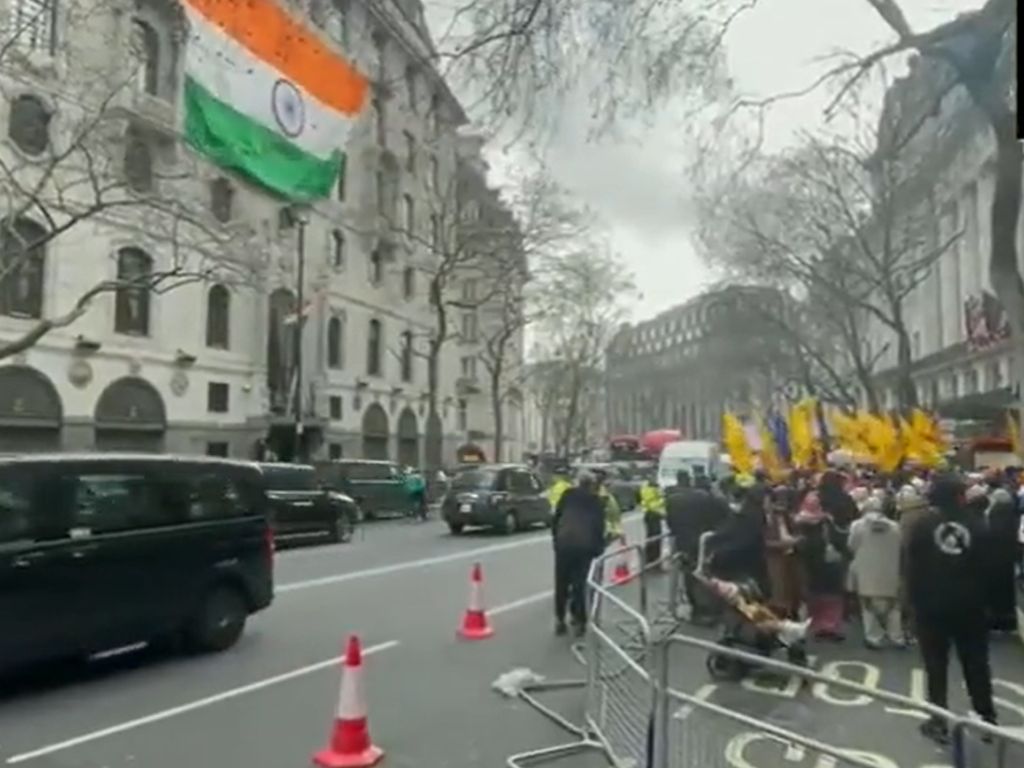 Pro-Khalistan protesters demonstrate behind barricades in front of the Indian high commission in London