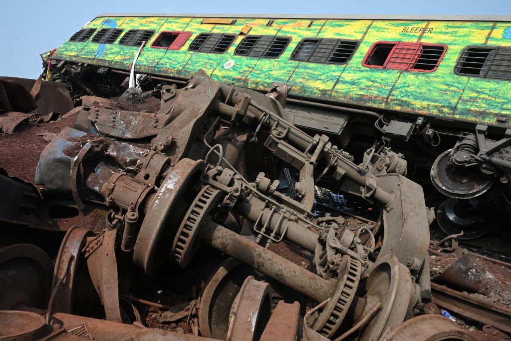 Odisha train crash in PICS: Locomotive sits atop goods wagon; tireless rescue operations...