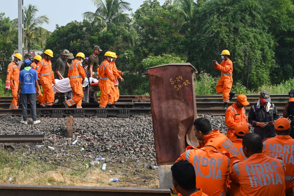 Odisha train crash in PICS: Locomotive sits atop goods wagon; tireless rescue operations...